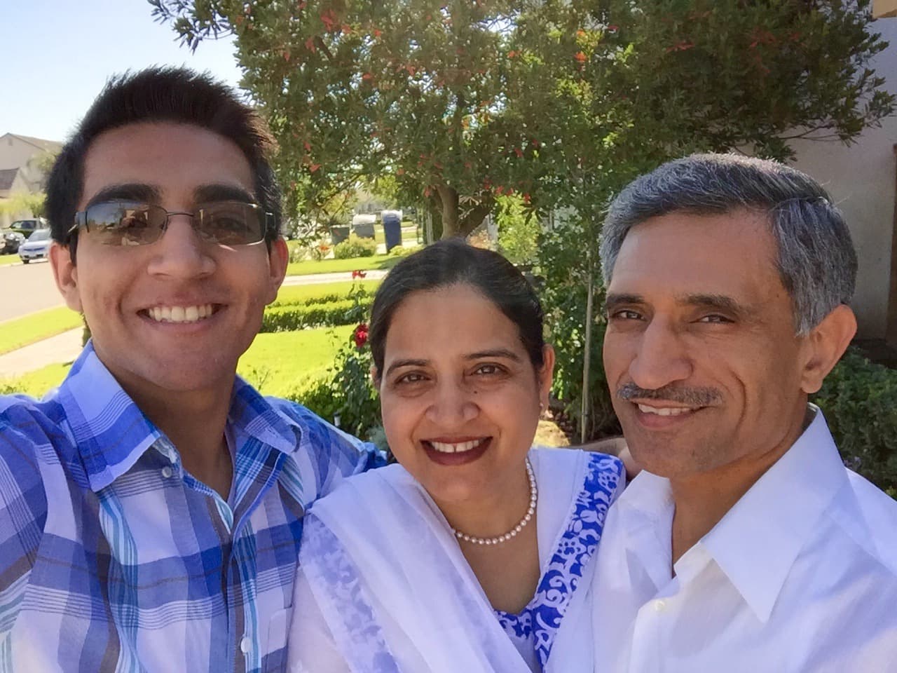 Selfie of my parents and me in our front yard at the time.